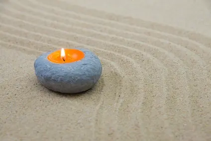 Sand und Kerze